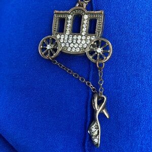 Cinderella carriage and hanging shoe necklace.